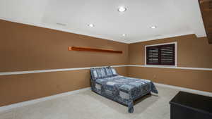 Tiled bedroom featuring crown molding