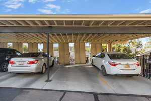 View of car parking featuring a carport