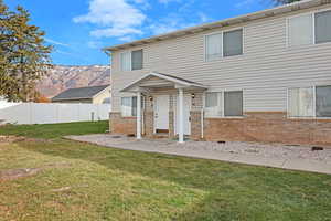 View of front of home featuring a mountain view and a front yard