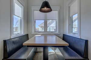 Dining space with wood-type flooring