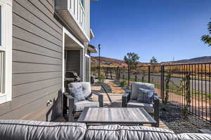 View of patio / terrace featuring an outdoor living space and a mountain view