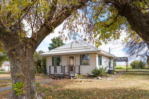 Bungalow-style house featuring a front yard