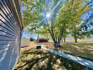 View of yard with an outdoor structure