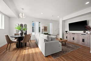 Living room featuring a textured ceiling and light wood-type flooring