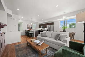 Living room featuring dark hardwood / wood-style flooring and a textured ceiling