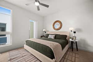 Carpeted bedroom with ceiling fan