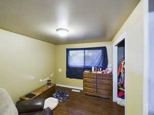 Sitting room featuring dark hardwood / wood-style floors