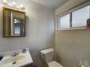 Bathroom with vanity and toilet