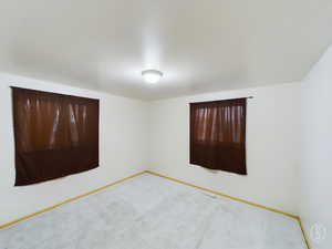 Empty room with carpet floors