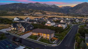 Aerial view at dusk featuring a mountain view