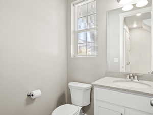 Bathroom featuring vanity and toilet