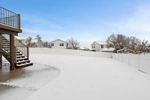 View of back yard layered in snow