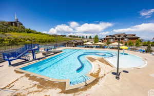 View of swimming pool with a patio