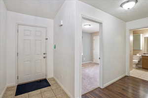 Entryway featuring light wood finished floors and baseboards