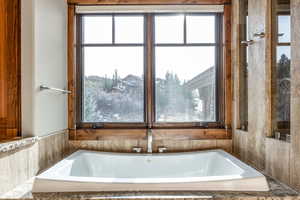 Bathroom with tiled bath