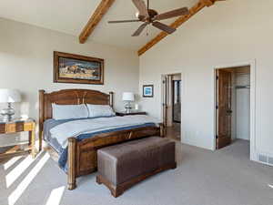 Bedroom featuring ceiling fan, beam ceiling, light colored carpet, and high vaulted ceiling