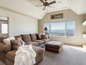 Living room featuring carpet, a mountain view, and lofted ceiling