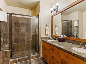 Bathroom with vanity and an enclosed shower