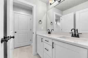 Bathroom with vanity and tile patterned flooring