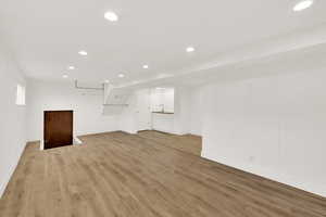 Unfurnished living room with light hardwood / wood-style flooring