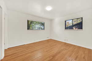 Spare room with light hardwood / wood-style floors