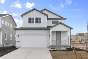 View of front of home featuring a garage