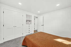 Bedroom featuring a closet and carpet floors