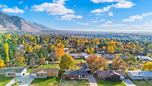 Birds eye view of property with a mountain view