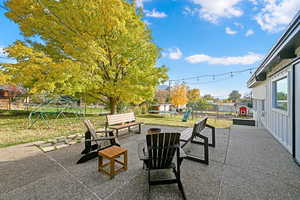 View of patio with a playground