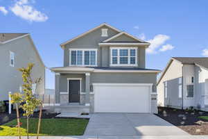 View of front of home featuring a garage