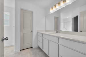 Bathroom with vanity and an enclosed shower