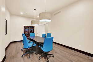 Dining room with hardwood / wood-style flooring