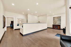 Interior space featuring a kitchen island and light wood-type flooring