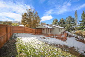 Beautiful fenced yard with mature landscaping and automatic sprinklers