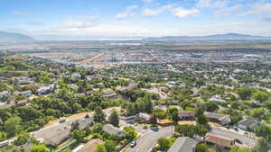 Aerial perspective of suburban area featuring a mountain backdrop