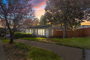 View of front of house featuring roof mounted solar panels