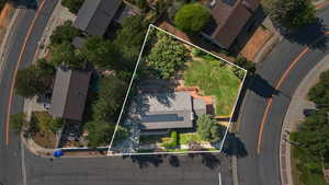 Aerial view of property and surrounding area with property parcel outlined