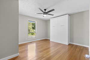 Murphy bed and hardwood floors included