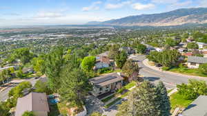 Aerial perspective of suburban area with a mountain backdrop