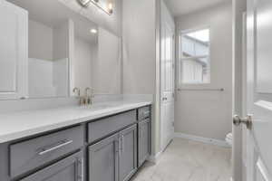 Bathroom with vanity and toilet