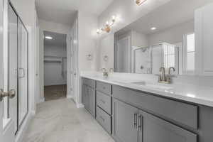 Bathroom with vanity and walk in shower