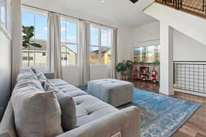 Living room featuring natural light and vaulted ceilings