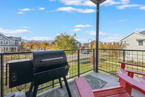 Balcony featuring a mountain view and grilling area