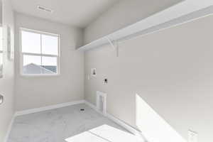 Washroom with washer hookup and hookup for an electric dryer