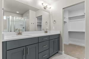 Bathroom with vanity and walk in shower