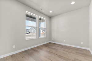 Spare room featuring light hardwood / wood-style floors