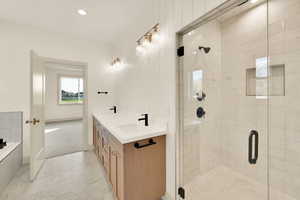 Bathroom with vanity and an enclosed shower