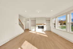 Unfurnished living room featuring light hardwood / wood-style flooring