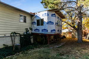 View of home's exterior with a storage unit