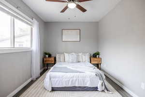 Bedroom featuring ceiling fan and wood-type flooring